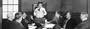 men around a board table